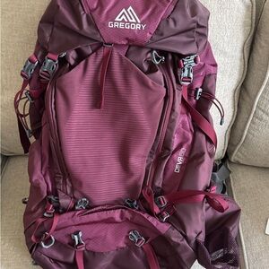 Gregory burgundy hiking backpack with multiple pockets